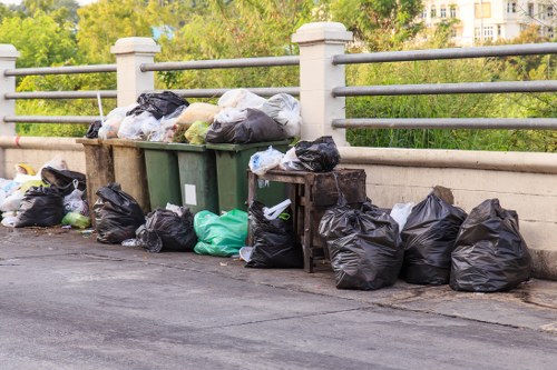 Sorting items outside a house for recycling in Loughton