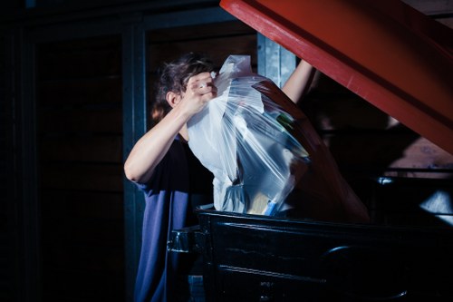 Residents disposing of furniture at a local recycling center in Loughton