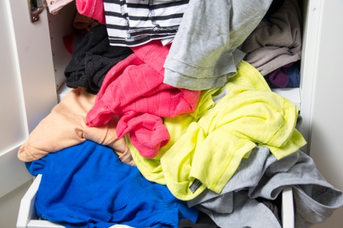 Workers wearing PPE and conducting safe lifting during clearance